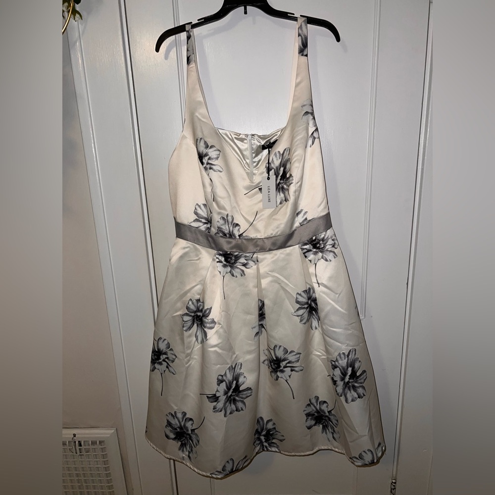 White and blue/grey floral dress. sweatheart neckline with 1in straps